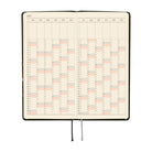 An open 2027 planner showing a yearly calendar spread. The pages are cream-colored and a black and silver ribbon bookmark hangs from the bottom center against a plain white background.