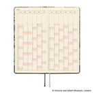An open 2027 daily planner spread showing two printed calendar pages with a yearly grid, photographed on a white background.