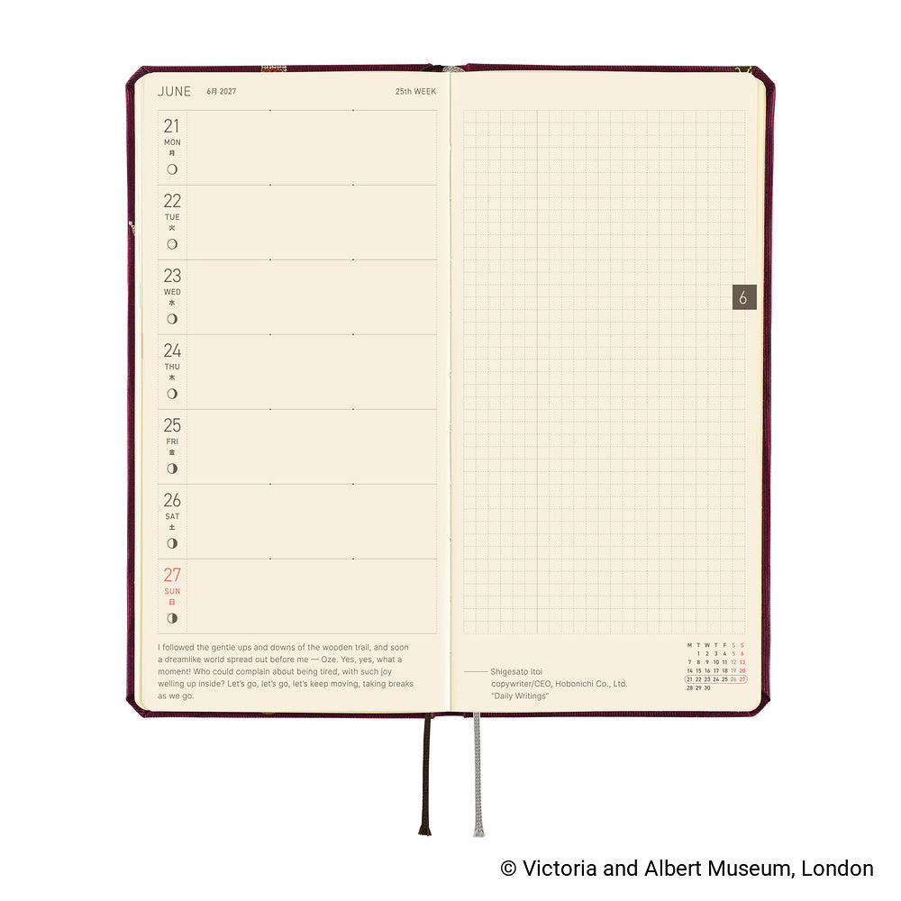 An open hardcover planner showing two interior spreads: the left page has a weekly schedule layout with dates from Monday to Sunday, and the right page has a light beige grid. The cover is dark red-brown, and the pages are cream.