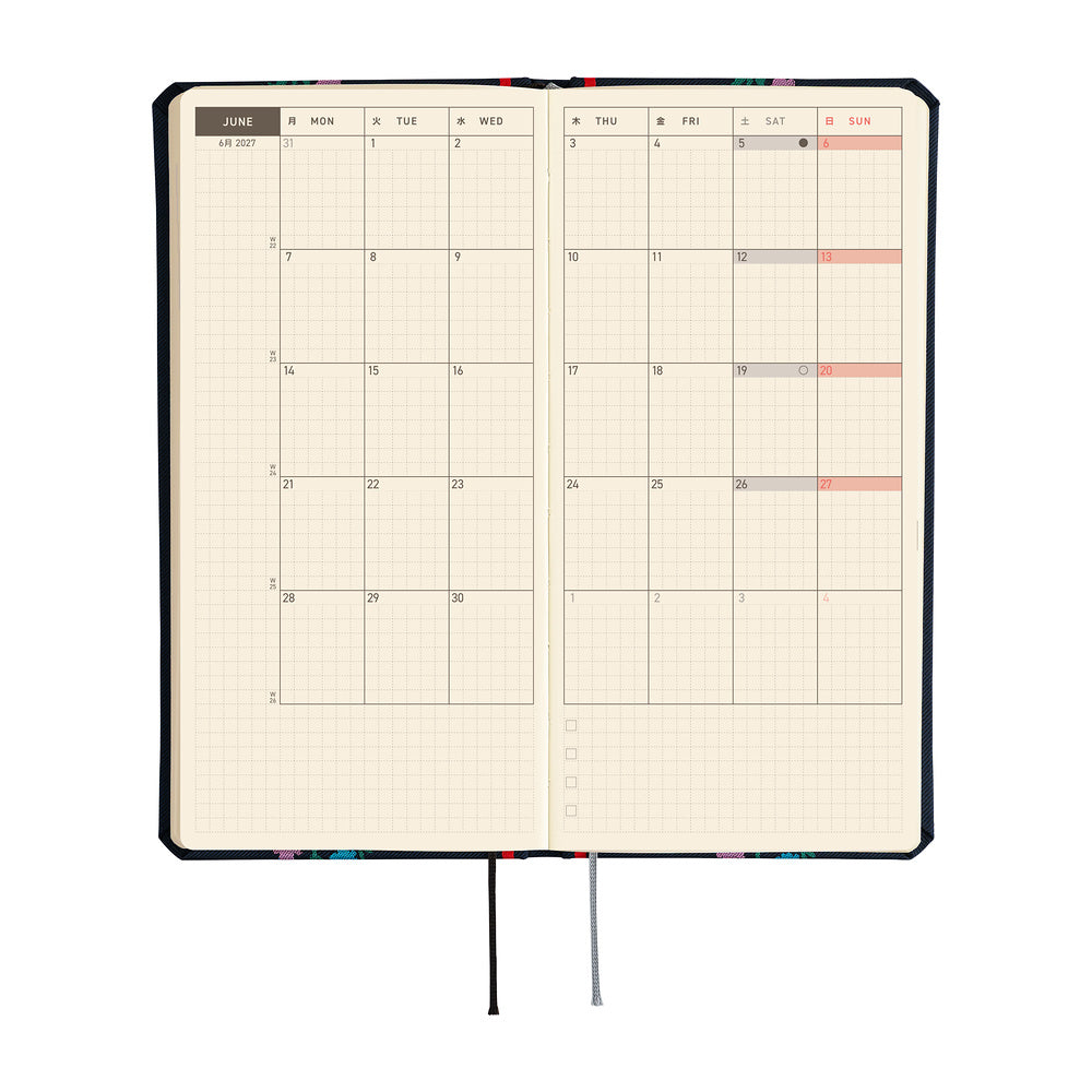 An open monthly planner on cream colored pages, shown on a plain white background.