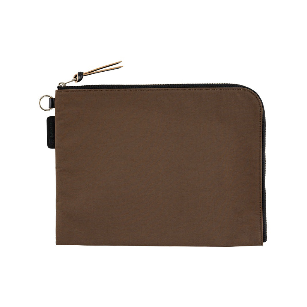 A brown A5 zippered tragen flat pouch closed on white background