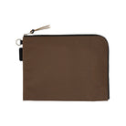 A brown A5 zippered tragen flat pouch closed on white background