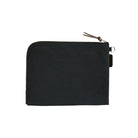 A black A6 zippered Tragen flat pouch on white background