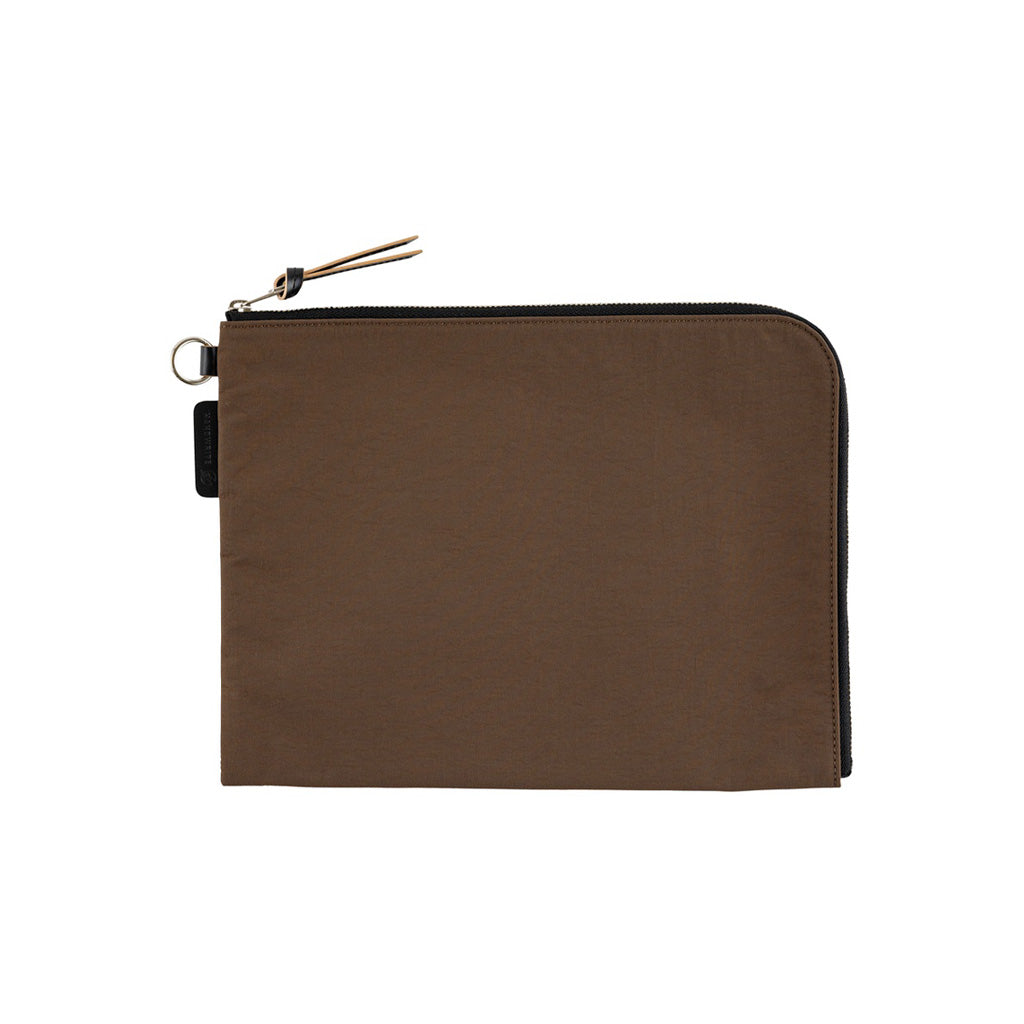 A brown A6 zippered Tragen flat pouch on white background