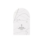 A single arched sheet of blotting paper shown on a clean white background. The paper features minimalist black abstract line art and text detailing its features.
