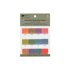 A package of 12 translucent sticky notes in a monthly color-coding system, featuring a muted olive green header card with product details and a grid of 12 colored tiles below representing each month.