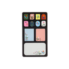 A rectangular black pad with multiple colorful floral and geometric sticky notes, shown on a plain white background.