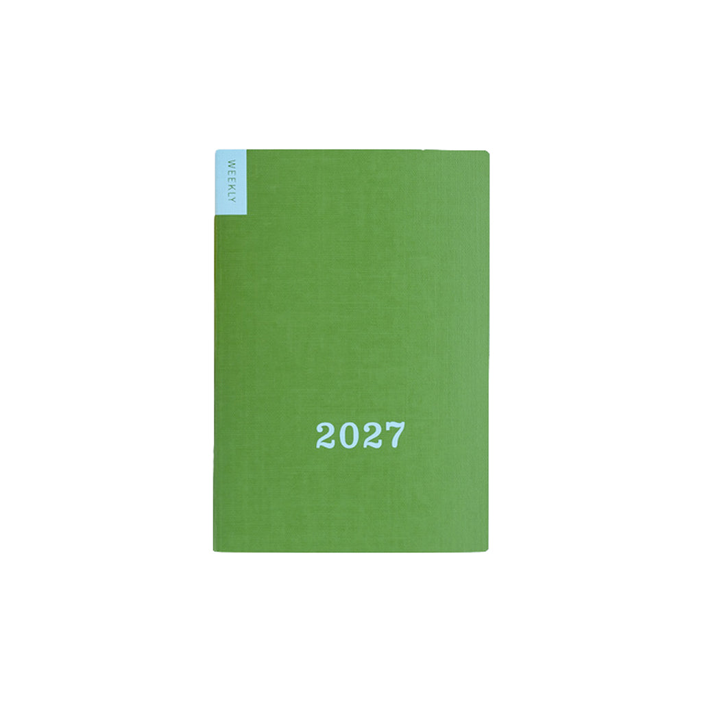 Green Hobonichi weekly calendar with blue '2027' text on front on white background
