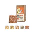 Bars of Hogwash SallyeAnder stain removing soap next to packaging on white background