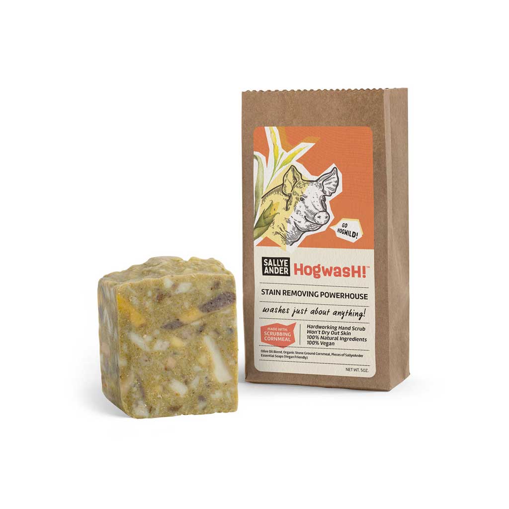 Bar of Hogwash SallyeAnder stain removing soap next to packaging on white background
