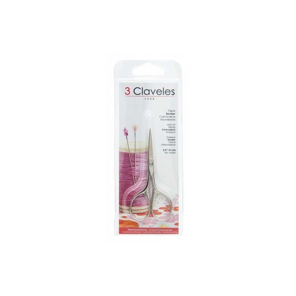 Pair of embroidery scissors in 3 Claveles packaging on white background