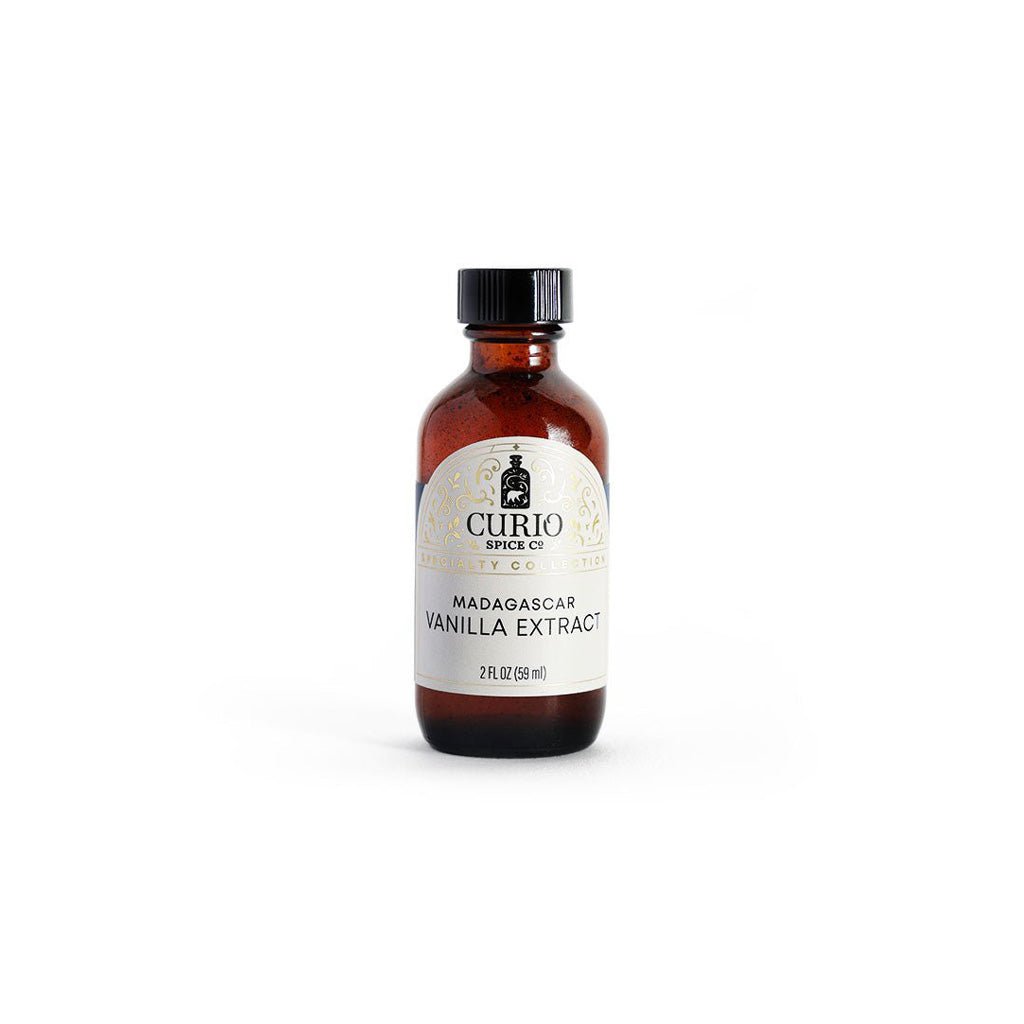 Bottle of Curio Spice Co. Madagascar Vanilla Extract on a white background