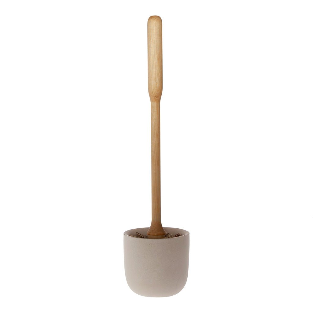 A concrete toilet brush holder with toilet brush on white background.