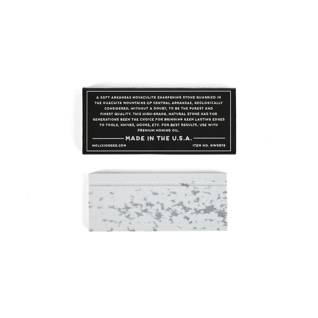Ironquill sharpening stone on white background next to box with text