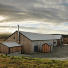 A large rustic wooden barn.
