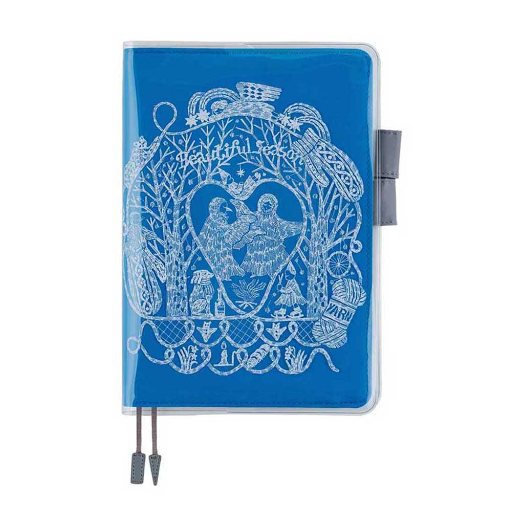 Clear cover on cover with white hand drawn illustration on top of blue fabric cover for Hobonichi Techo Cousin A5 planner on white background