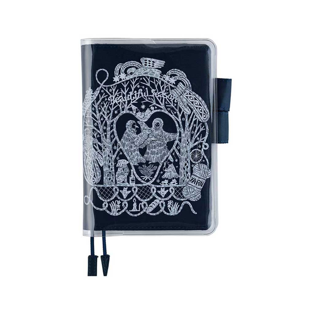 Clear cover on cover with white hand drawn design on top of navy blue fabric cover for Hobonichi Techo A6 planner on white background