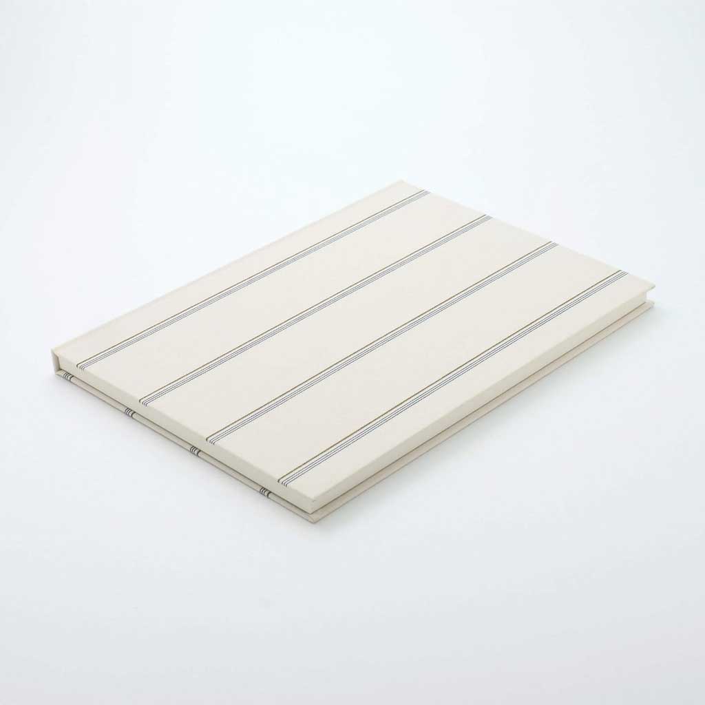 Beige notebook with gray stripes on a white background