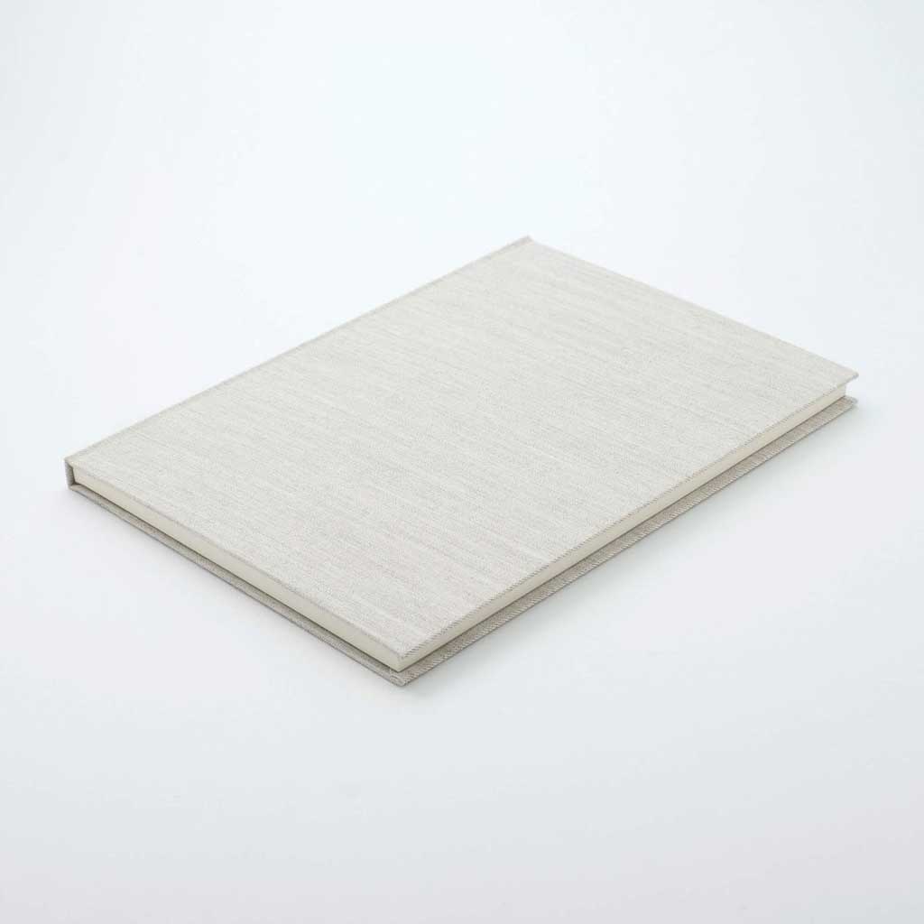Light grey woven notebook on white background