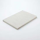 Light grey woven notebook on white background