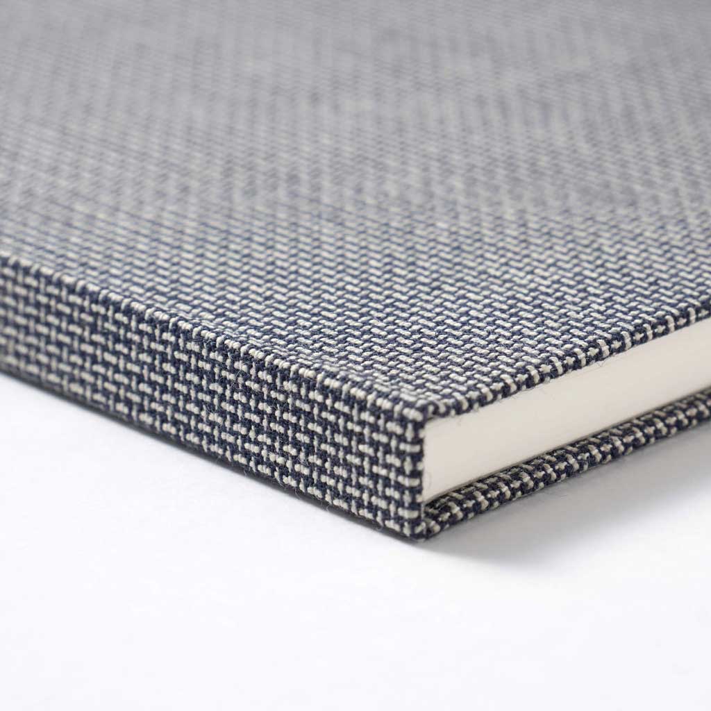 Textured gray A5 notebook on a white background