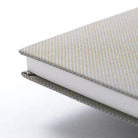 Corner of notebook with woven cotton cover.