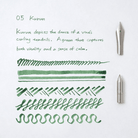 Green brush strokes and text on a white background with a pen.