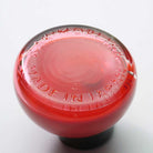 Bottom of glass bottle of red ink with Kakimori Made in Japan inscription