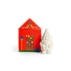 Small gnome-shaped soap bar next to decorative red cottage box.