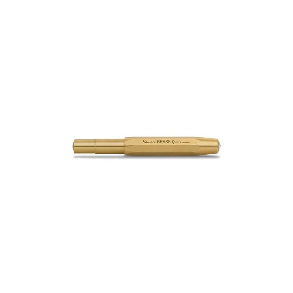 Closed brass fountain pen on white background