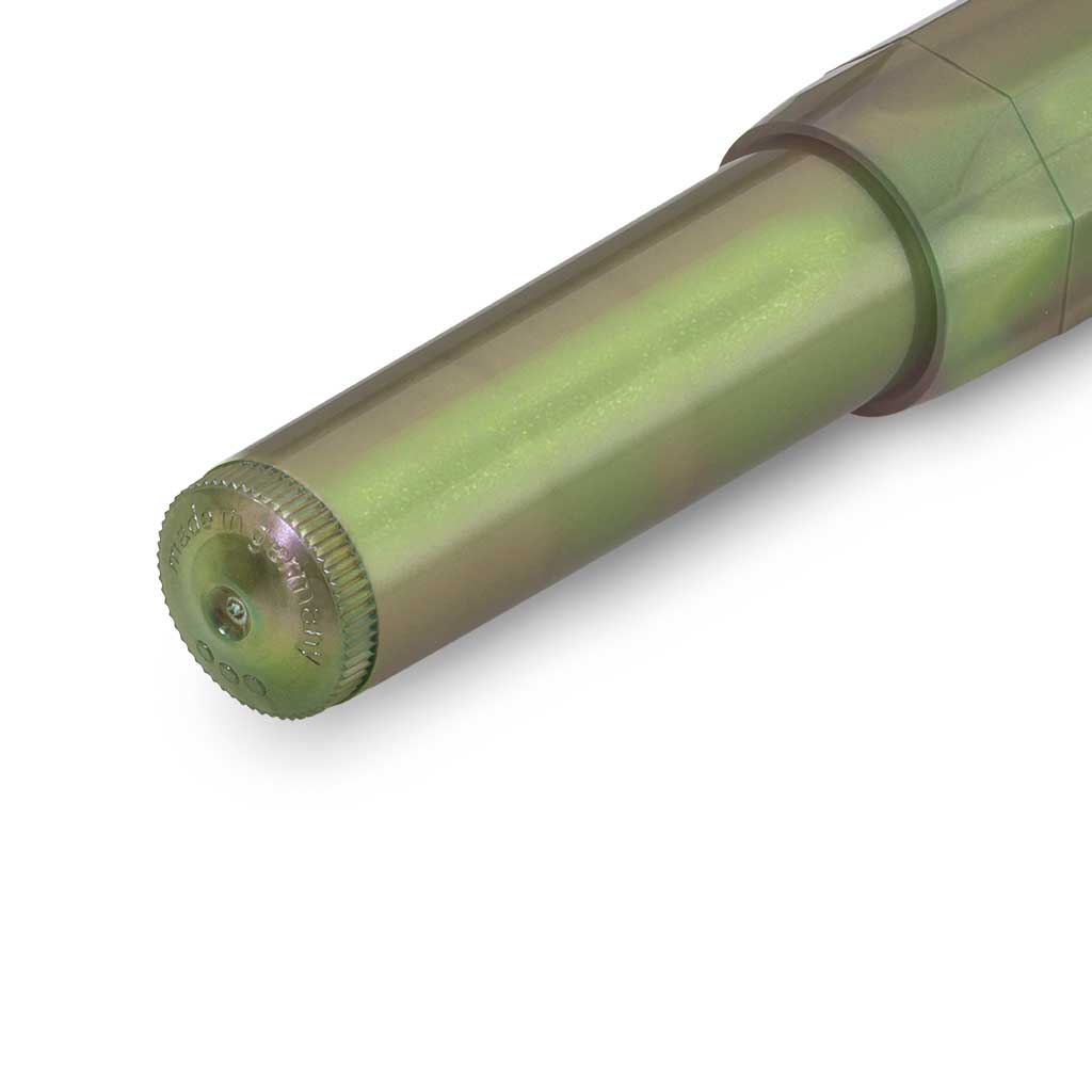 Close-up of dark shadow green pen on white background