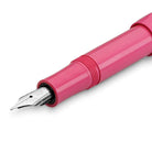 Pink Kaweco fountain pen with silver nib on a white background