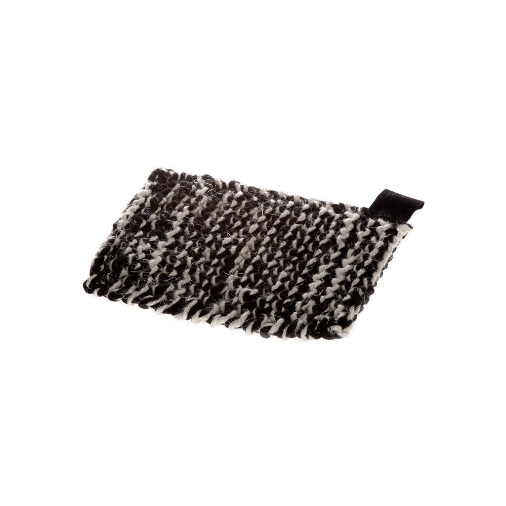 Black and white knitted fabric kettle holder on white background