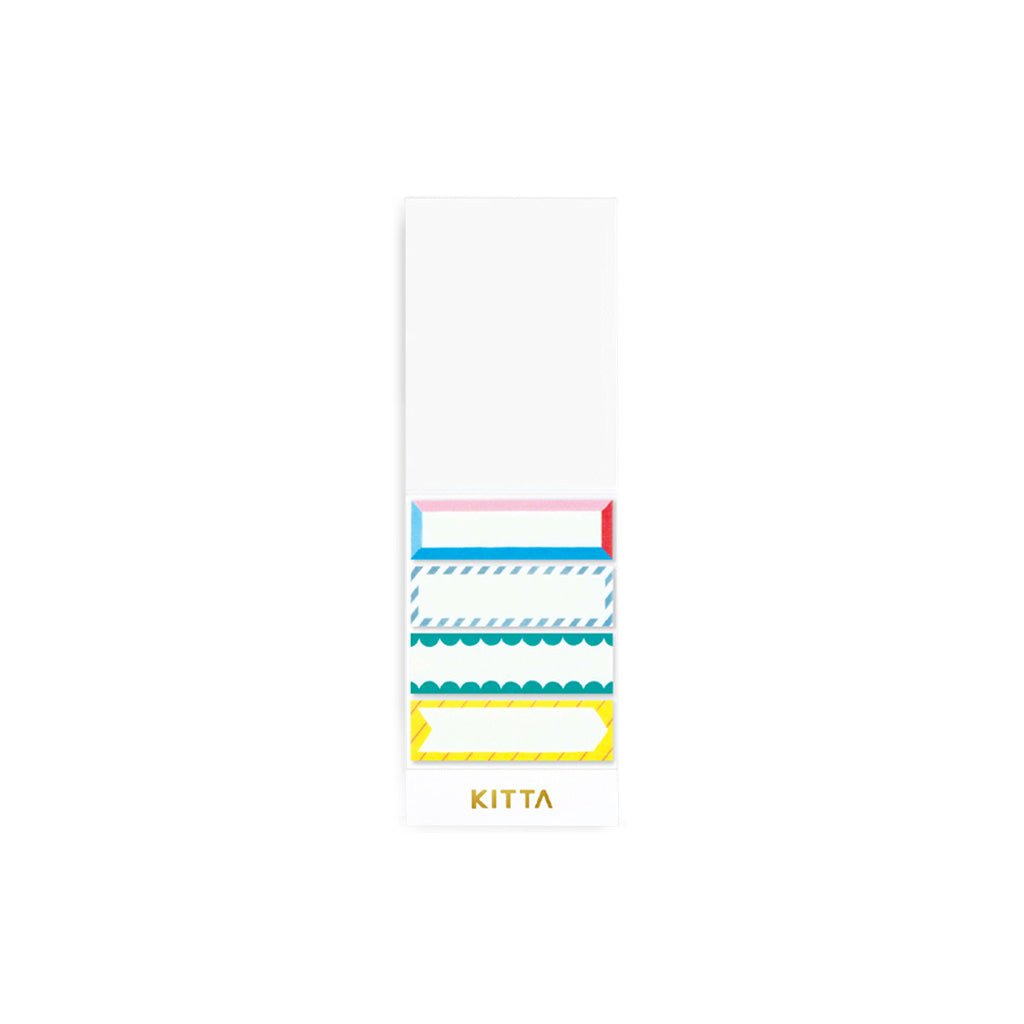 Set of pre-cut washi stickers with colorful frame designs in paper holder on white background