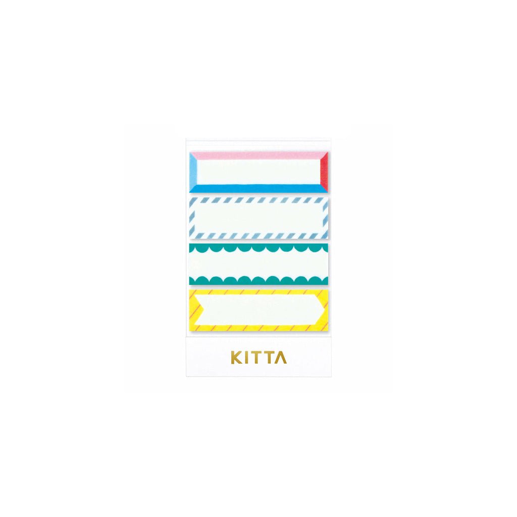 Set of pre-cut washi stickers with colorful frame designs in paper holder on white background