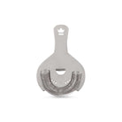 Metallic Koriko cocktail strainer with coil and straining holes on a white background