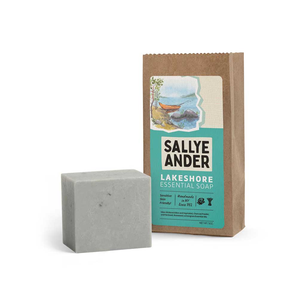 Bar of SallyeAnder Lakeshore essential soap for dry or irritated skin next to packaging on white background