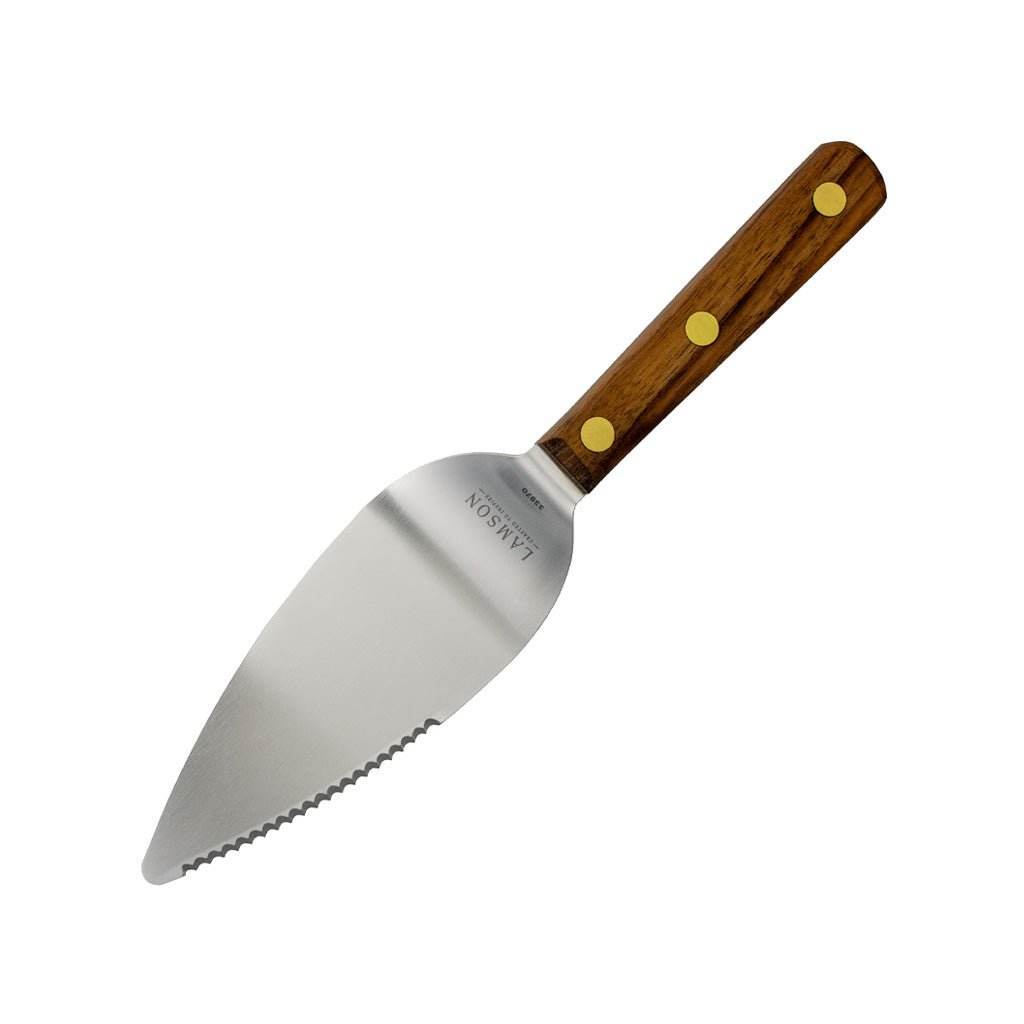 A pie server with a serrated-edged blade and wooden handle on white background.