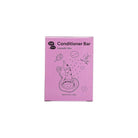 Pink box of a conditioner bar with cartoon illustrations on a white background