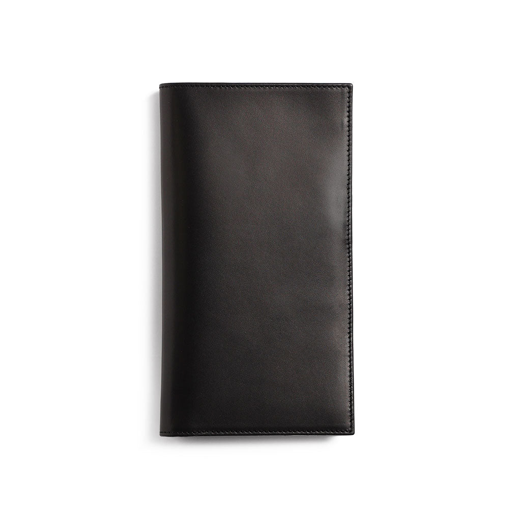 Black leather Traveler's Notebook wallet insert on white background