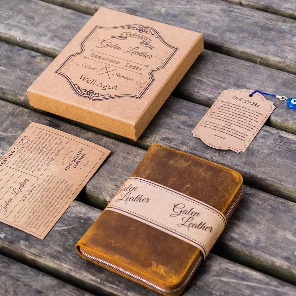 Galen Leather brown pen case and packaging on a wooden surface