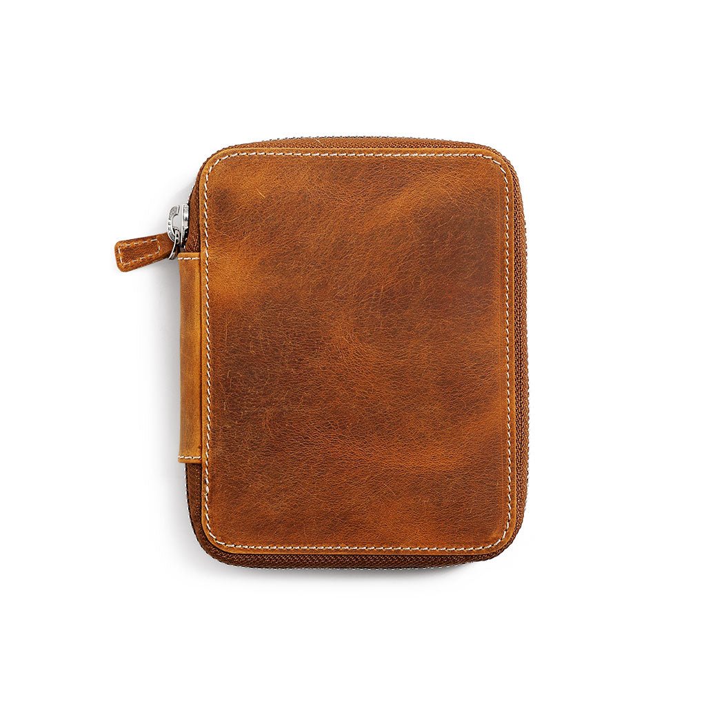 Crazy horse Brown leather zippered pen case on a white background