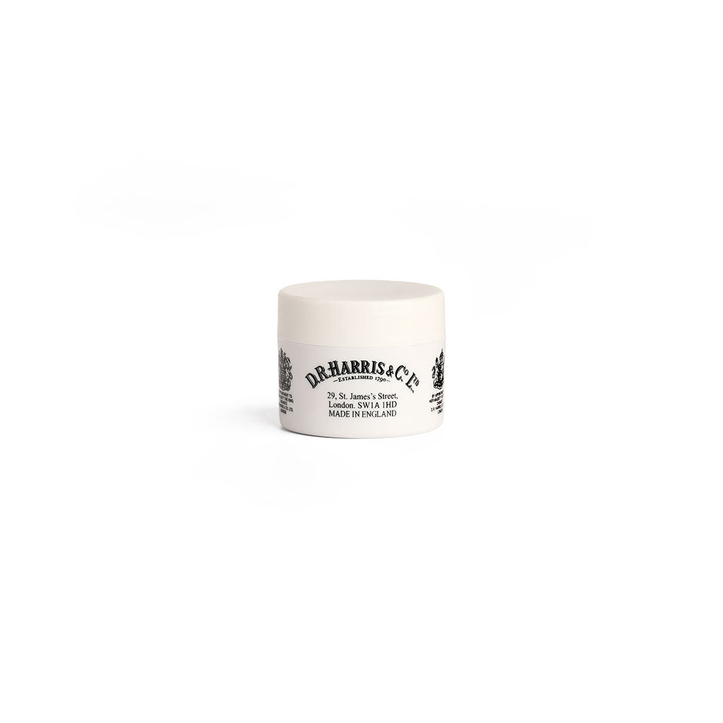 Jar of D.R. Harris lip balm on white background