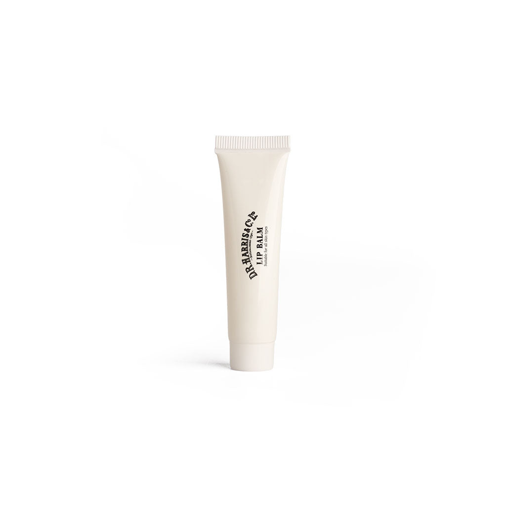 White D.R. Harris lip balm tube with black text on a white background