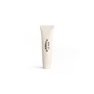 White D.R. Harris lip balm tube with black text on a white background