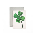Small greeting card with a clover illustration, paired with an envelope