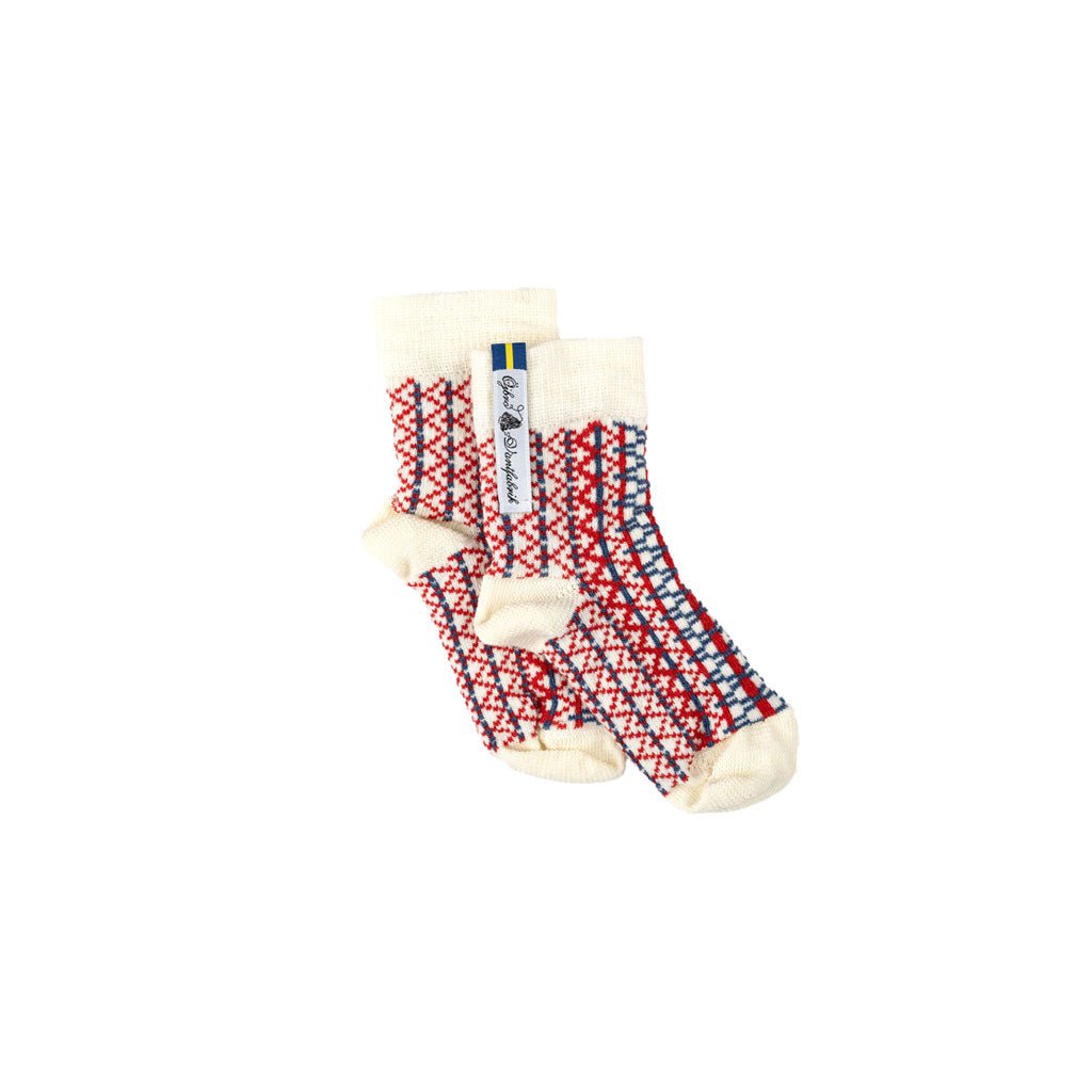 Pair of socks with a red and blue pattern on a white background