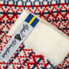 Textile product with a label on a patterned fabric background
