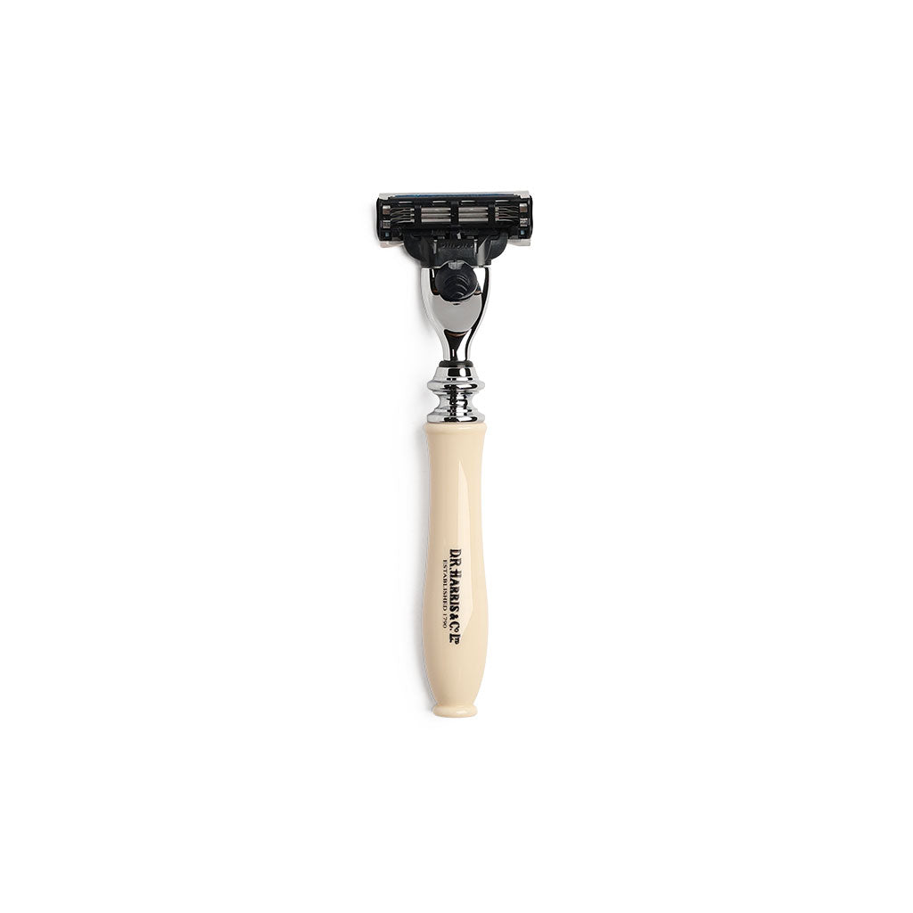 Chrome razor with imitation ivory handle and D.R. Harris branding on white background