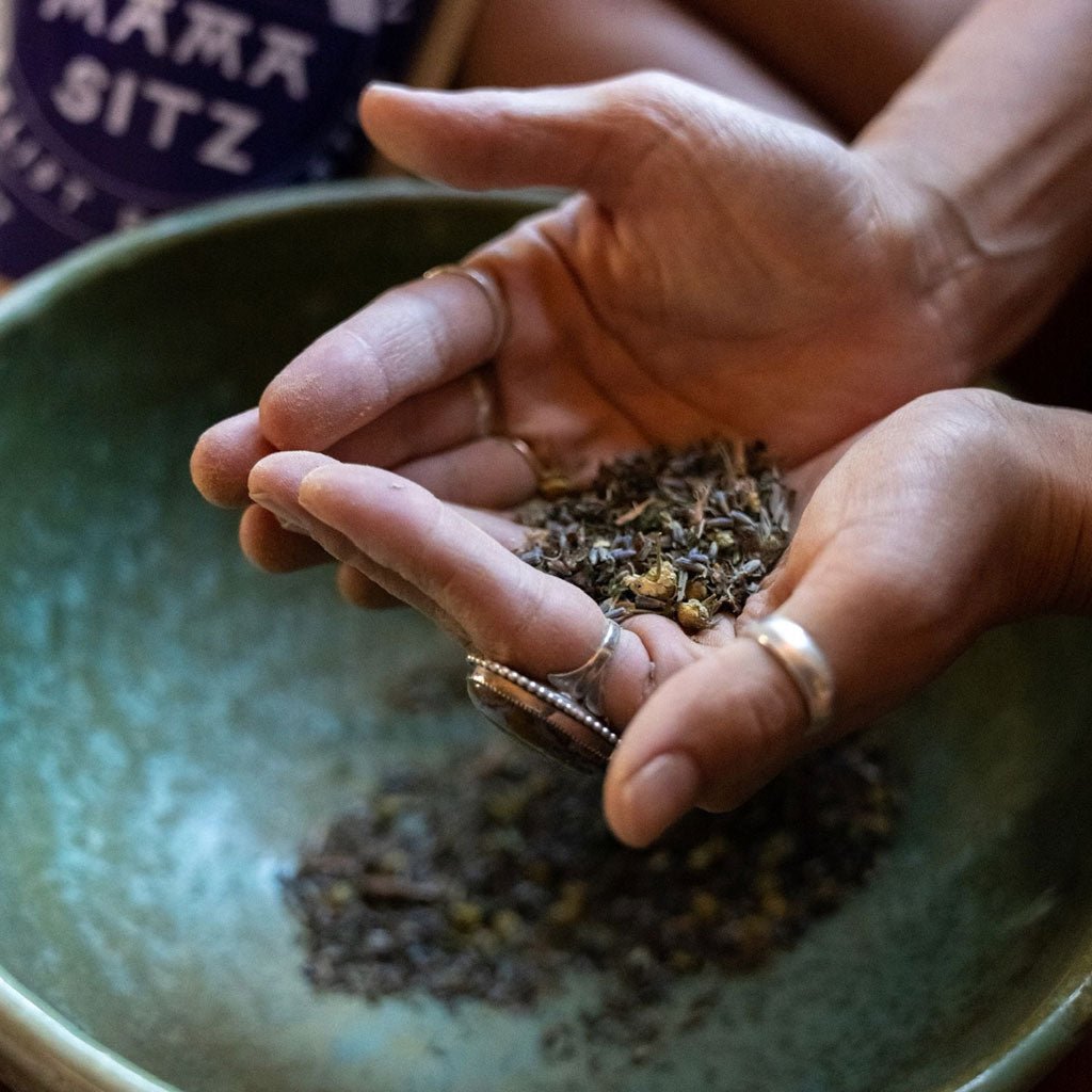 Person holding a small amount of mama sitz in their hands